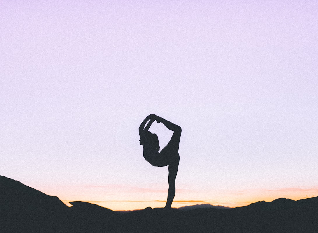 Mature person performing a beneficial stretch routine